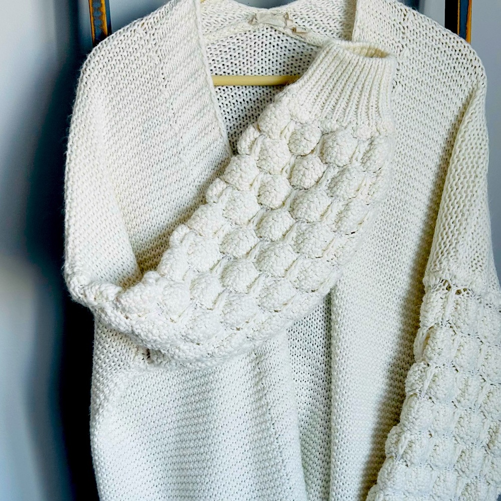Used white bubble arm sweater.
